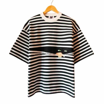 Knitted Peeping Tee front view showing textured knit fabric and t-shirt design